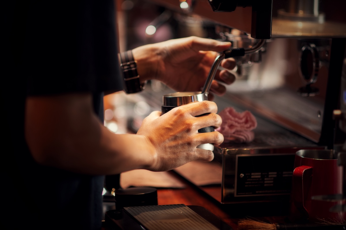 Close up Barista making cappuccino, bartender preparing coffee drink
