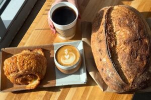 Bread, a cinnamon roll and coffee 