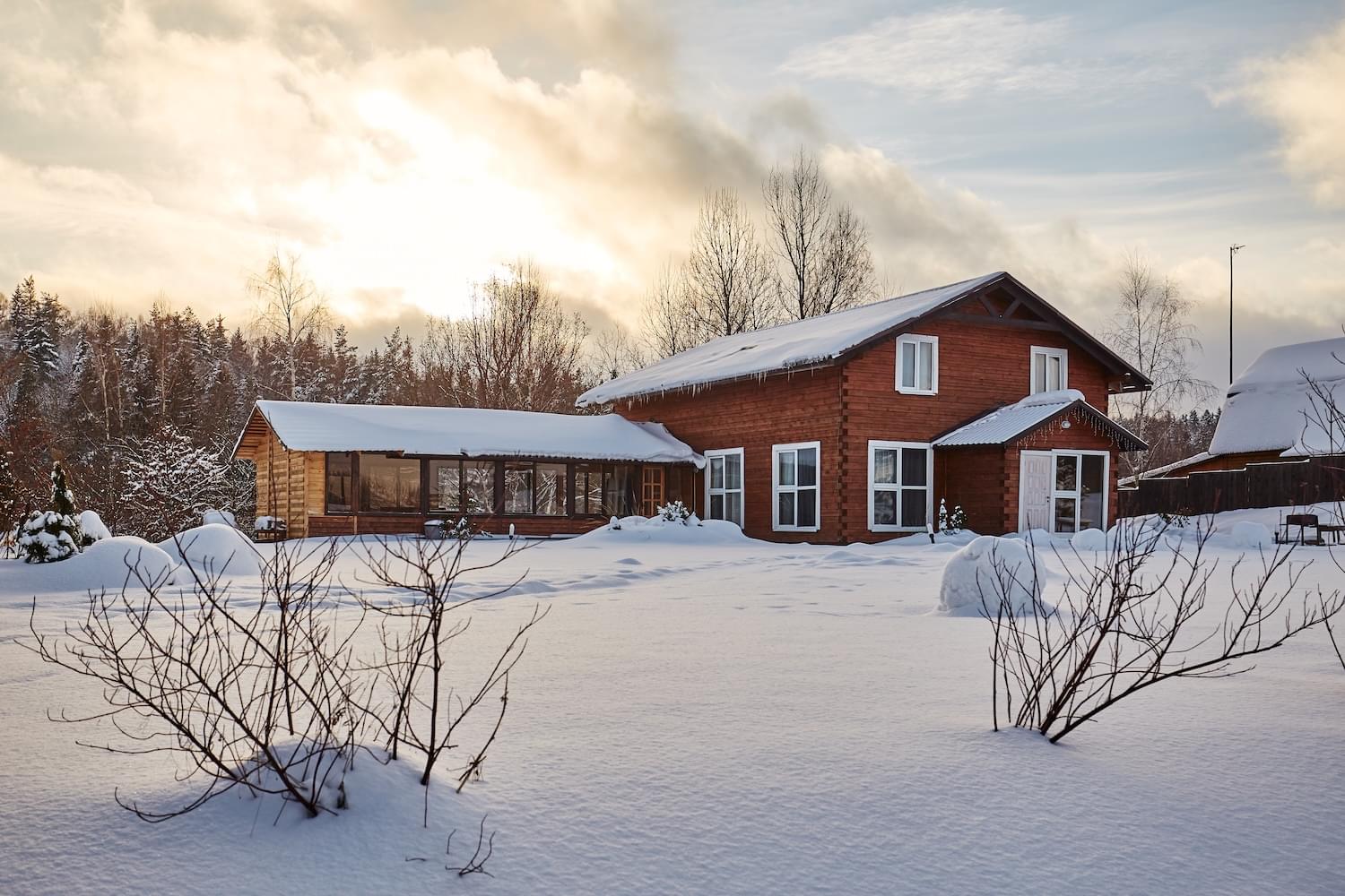 Winter house on winter snowy panoramic landscape.